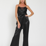 SLEEK SATIN LACE-TRIM JUMPSUIT IN MIDNIGHT BLACK.