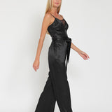SLEEK SATIN LACE-TRIM JUMPSUIT IN MIDNIGHT BLACK.